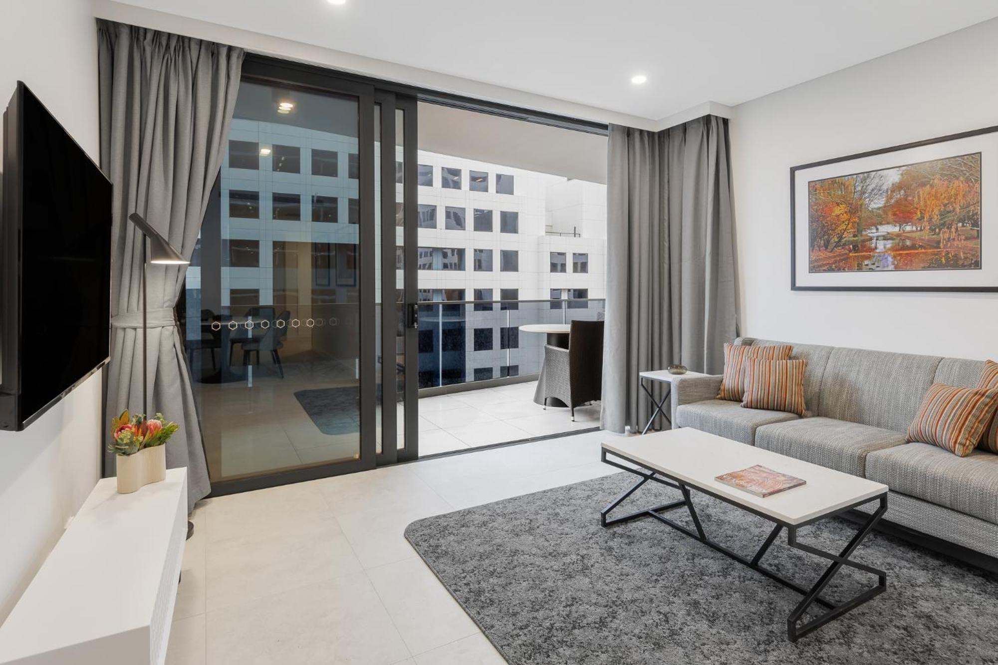 Meriton Suites Canberra Exterior foto Living room